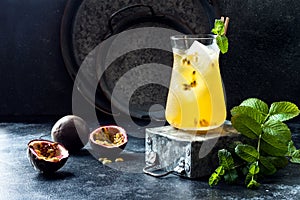 Passionfruit iced green tea or lemonade with lime and mint. Tropical refreshing cold drink