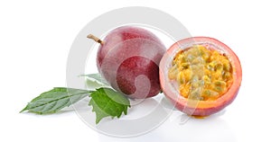 Passionfruits with green leaves isolated on white background