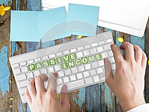 Passive Income concept on green keyboard button.