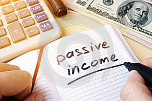 Passive income written in a note.