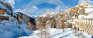 Passo Fedaia. View of frozen Fedaia lake from the dam.