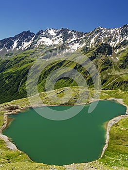 Passo Gavia mountain pass in Lombardy Italy to Val Camonica at summer. Lake