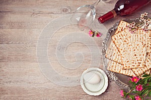 Passover background with matzah, seder plate and wine. View from above photo