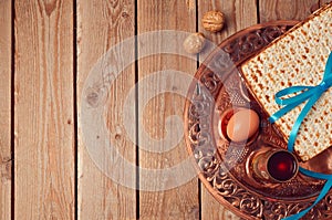 Passover background with matzo and vintage seder plate.