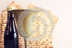 Passover background. Old Wine cup and matzoh (jewish holiday bread