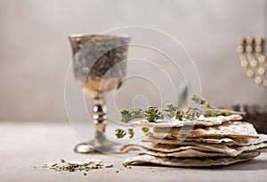 Passover, the Feast of Unleavened Bread, matzah  and  Kosher red wine glasses shofar horn with copy space