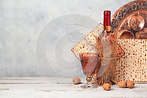 Passover holiday concept with wine and matzoh over rustic background