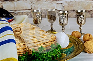 Passover holiday traditional celebration with four cup wine kosher matzah on Jewish Pesach