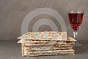 Passover matzos and glass of wine on table. Pesach celebration