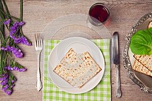 Passover (pesah) holiday table setting with seder plate and matzoh. View from above