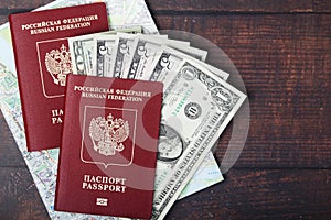 A passport with american dollar banknotes inside as work and travelling concept