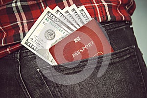 Passport in the back jeans pocket with American dollars.