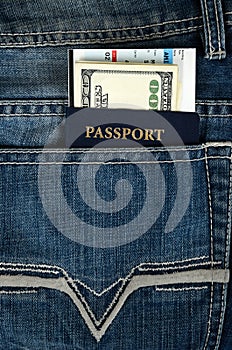 Passport with boarding pass and money in jeans