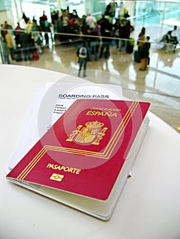 Passport and boarding pass, waiting for a flight in an airport
