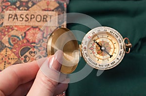 passport ,compass and pink backpack for tourist travel,packing clothes for the trip