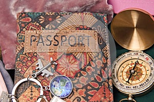 passport ,compass and pink backpack for tourist travel,packing clothes for the trip