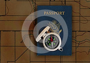 Passport and compass on topographical map photo