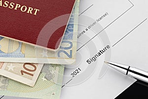 Passport with euro banknotes, document signing