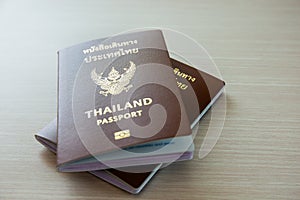 Passport for International travel and business laid out on a wooden background. Copy space background