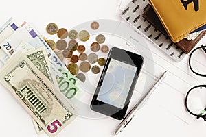 Passport money phone with map and glasses on white background,