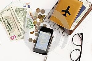 Passport money phone with map and glasses on white background,