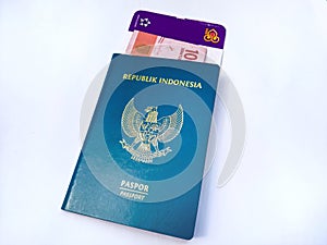 Passport, money, and ticket on broken white background