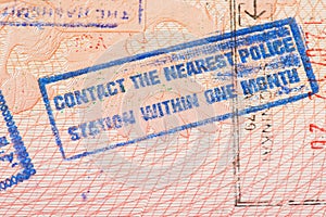 Passport page with Jordan immigration control stamp instructing to contact the nearest police station within one month.