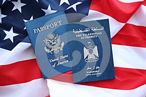 Passport of Palestinian Authority with US Passport on United States of America folded flag
