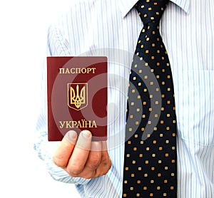 The passport for travel abroad in a man's hand