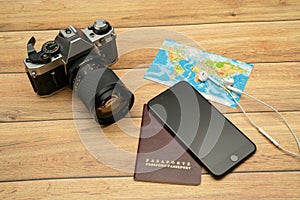 Passport, world map, glasses, camera, smartphone. Travel concept