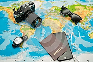 Passport, world map, glasses, camera. Travel concept