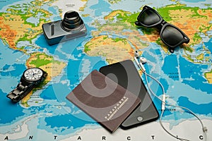 Passport, world map, glasses, camera. Travel concept