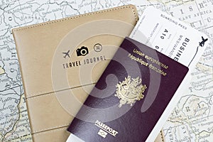 Passports, Boarding Pass, and Travel Book on Map