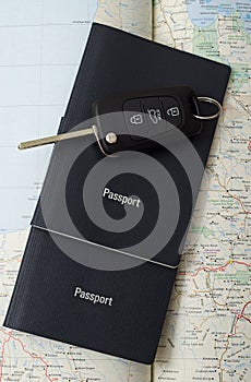 Passports and car key and map