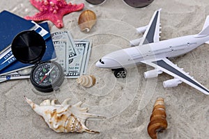 Passports with tickets on sand with toy plane