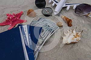 Passports with tickets on sand with toy plane