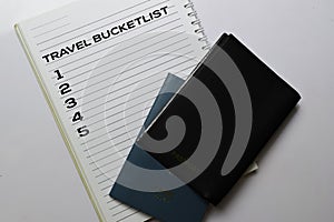 Passports and Travel Bucketlist write on a book isolated white background. holiday concept photo