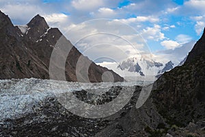 Passu glacier in surrounded by Karakoram mountain range in summer season view from Patundas trekking route at sunrise, Gilgit