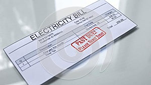 Past due seal stamped on electricity bill, month expenses, payment for services