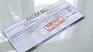 Past due seal stamped on water bill, month expenses, payment for services