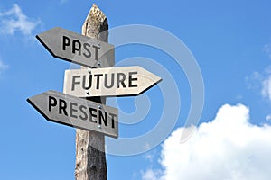 Past, future, present - crossroads sign with three arrows