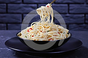 Pasta Aglio, Olio e Peperoncino on a fork