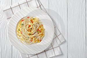 Pasta Aglio, Olio e Peperoncino on a plate photo