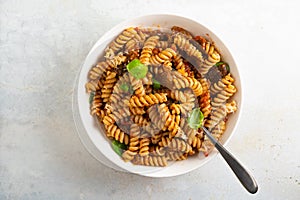 Pasta alla Norma - traditional Italian food with eggplant, tomato, cheese and basil