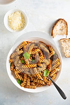 Pasta alla Norma - traditional Italian food with eggplant, tomato, cheese and basil