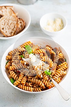 Pasta alla Norma - traditional Italian food with eggplant, tomato, cheese and basil