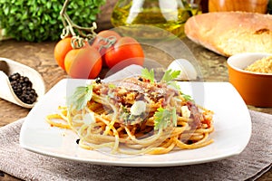 Pasta with anchovies, tomatoes photo