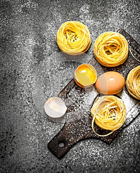 Pasta background. Cooking homemade pasta with egg and flour.