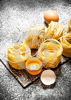Pasta background. Cooking homemade pasta with egg and flour.