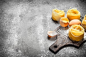 Pasta background. Cooking homemade pasta with egg and flour.